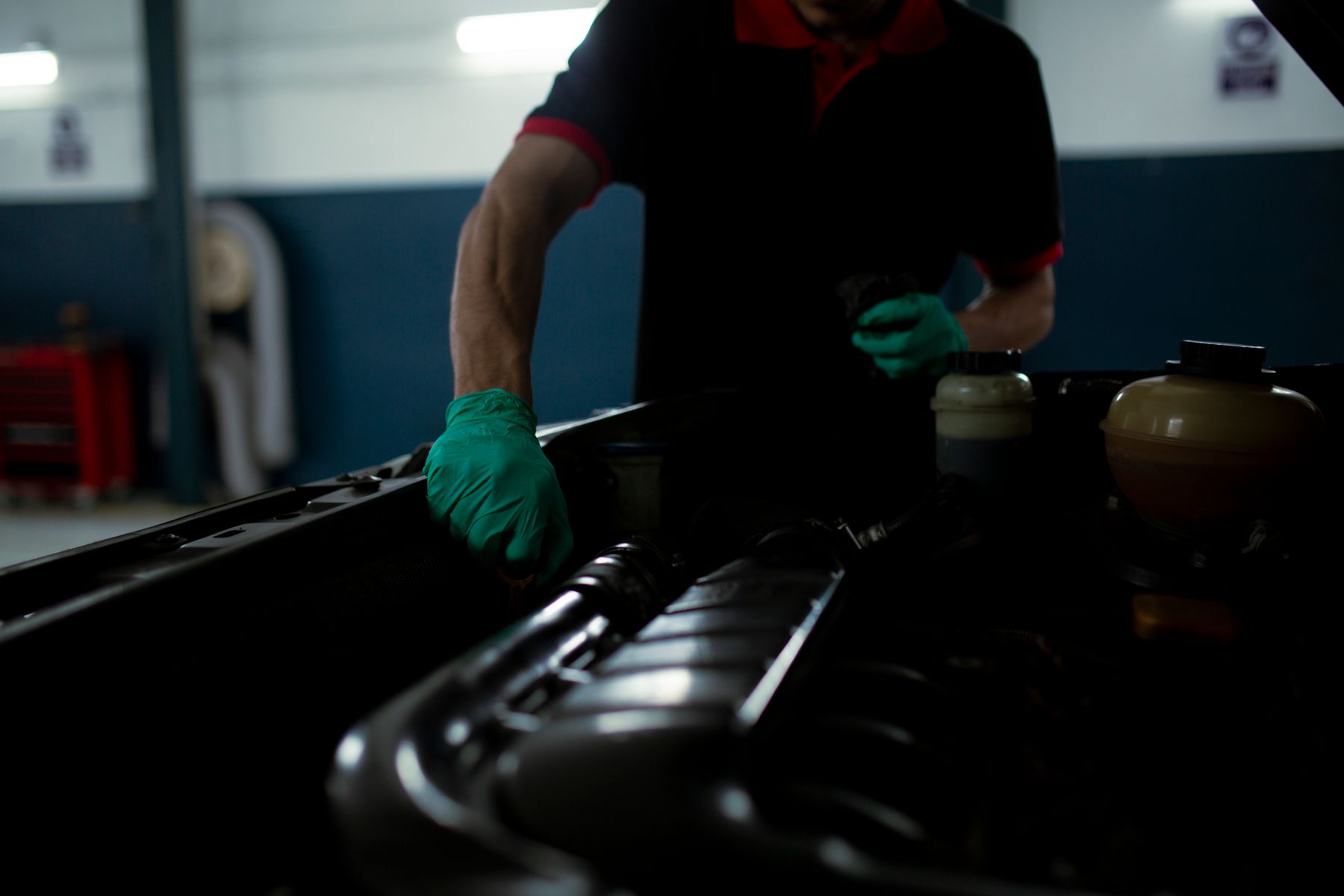 Mechanic inspecting a car engine