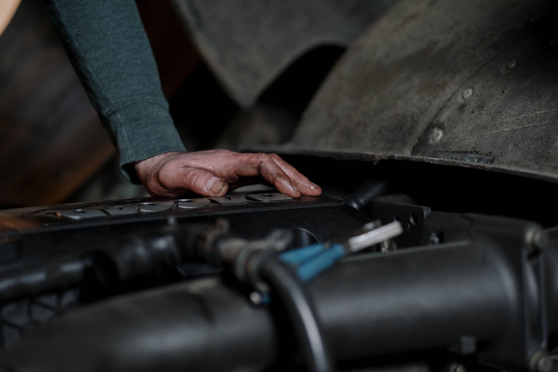 Technician inspecting engine components